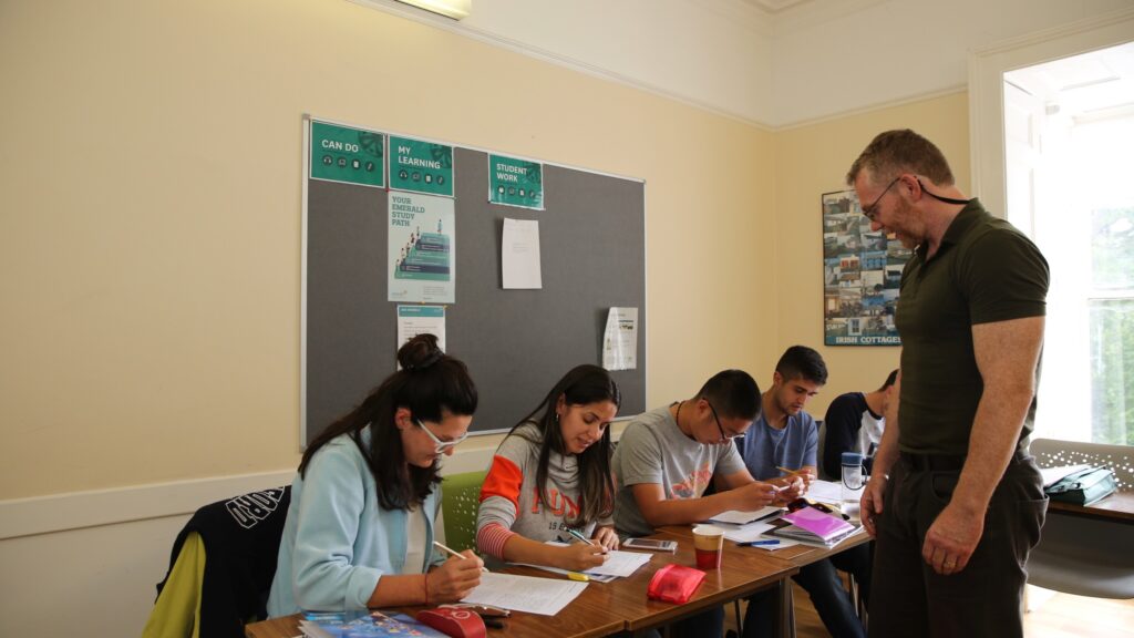 Teacher supporting international participants at Emerald Cultural Institute Dublin